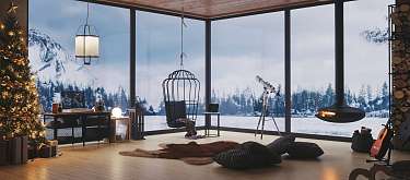 Exklusives Ferienhaus mit Panoramablick auf verschneite Berglandschaft I WUNDERORTE 